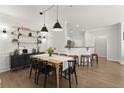 Elegant dining room with modern lighting, stylish furnishings, and open access to kitchen with bar seating at 2400 Cumberland Se Pkwy # 804, Atlanta, GA 30339