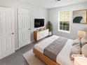 Cozy bedroom featuring a large window and a dresser at 4661 Cedar Park Trl, Stone Mountain, GA 30083