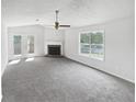 Bright living room featuring a fireplace and double doors at 4661 Cedar Park Trl, Stone Mountain, GA 30083