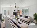 Bright living room with fireplace, ample seating, and large window at 4661 Cedar Park Trl, Stone Mountain, GA 30083