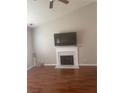 Bright living room with vaulted ceiling, fireplace, and hardwood floors at 4423 Roche St, Atlanta, GA 30349