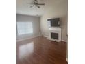 Cozy living room featuring a fireplace with marble surround and hardwood flooring at 4423 Roche St, Atlanta, GA 30349
