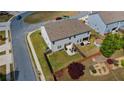 Aerial view of a fenced backyard with a patio, shed, and lush green grass at 7200 Brigidoon Rose, Douglasville, GA 30134