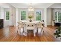 Bright dining room with hardwood floors, modern lighting, and large windows offering natural light at 78 Beverly Ne Rd, Atlanta, GA 30309