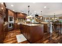 Gourmet kitchen featuring custom wood cabinets, granite counters and stainless steel appliances at 150 White Tail Ct, Fayetteville, GA 30214
