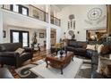 Grand living room with soaring ceilings, gleaming hardwoods and elegant finishes at 150 White Tail Ct, Fayetteville, GA 30214