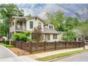 Charming two-story home with a covered deck and picket fence at 354 Greenwood Ave, Decatur, GA 30030