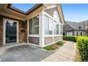 Charming home entrance with a glass door and stone accents, complemented by manicured landscaping at 311 Ridge Hill Cir # 1, Marietta, GA 30064