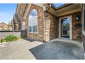 Inviting stone home entrance with an arched window and glass door, showcasing a welcoming ambiance at 311 Ridge Hill Cir # 1, Marietta, GA 30064