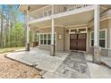 Welcoming front entrance with a double door, stone walkway and a cozy porch area at 3800 Macland Rd, Hiram, GA 30141