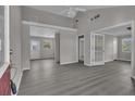 Spacious living room with gray walls and hardwood-style floors bathed in natural light at 1509 Stone Gate Ln, Atlanta, GA 30317