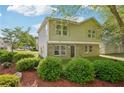 Two-story home with manicured shrubbery, brick base and neutral siding at 4437 Ben Hill Rd, Atlanta, GA 30349