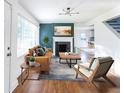 Cozy living room with hardwood floors, a modern fireplace, and comfortable seating at 22 Vinson Se Dr, Atlanta, GA 30317