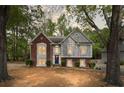 Charming two-story home features a well-manicured front yard and beautiful brick and siding accents at 3450 N Cook Rd, Powder Springs, GA 30127