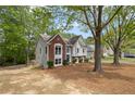 Charming two-story home features a well-manicured front yard and beautiful brick and siding accents at 3450 N Cook Rd, Powder Springs, GA 30127