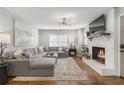Cozy living room with fireplace, plush seating, and an abundance of natural light at 5125 Dahlonega Hwy, Cumming, GA 30028