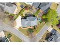 Aerial view of a home showcasing a large backyard with a pool and mature trees at 5334 Lake View Clb, Atlanta, GA 30338