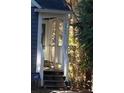 Inviting covered front entrance featuring steps leading up to a white framed door at , Marietta, GA 30008
