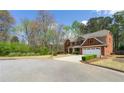 Lovely traditional home with a brick facade, complemented by a spacious, well-maintained lawn at 2251 Everleigh Ln, Marietta, GA 30064