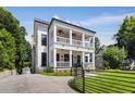 Elegant home with a charming double porch, manicured lawn, and inviting curb appeal at 542 Orme Ne Cir, Atlanta, GA 30306