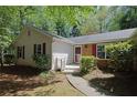 Exterior shot of the home's front entrance, walkway, and landscaping at 455 Tyson Cir, Roswell, GA 30076