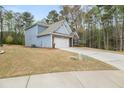 Exterior view of a charming blue house with a manicured lawn at 1037 Devon Dr, Acworth, GA 30102