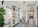 Hallway with views into the living room and decorative shelves at 791 Wylie Se St # 1111, Atlanta, GA 30316