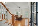 Sunlit dining room featuring hardwood floors and an elegant dining table at 1456 Hedgewood Nw Ln, Kennesaw, GA 30152