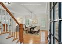 Elegant dining room featuring hardwood floors, large windows, and stylish furnishings at 1456 Hedgewood Nw Ln, Kennesaw, GA 30152