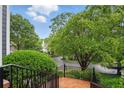 A view from the front stairs of the lush front yard and landscaping on a sunny day at 1456 Hedgewood Nw Ln, Kennesaw, GA 30152