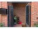 Inviting brick entryway with a security gate, mailbox, and unique decorative touches at 230 Bradberry Sw St # 9, Atlanta, GA 30313