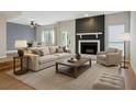 Stylish living room boasts a cozy fireplace, modern furniture, and an open layout at 2005 Variations Ne Dr, Atlanta, GA 30329