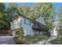 Inviting two-story home with a charming front porch and a well-manicured lawn at 260 Sterling Dr, Powder Springs, GA 30127