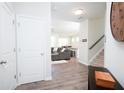 Bright foyer with hardwood floors, an entryway closet, and staircase leading to the second floor at 3080 W Jackson Way, Austell, GA 30106