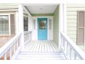 Close-up of a bright blue front door with sidelights and white trim, creating a cheerful entrance at 1206 Park Place Dr, Jonesboro, GA 30236