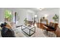 Bright living room featuring hardwood floors, neutral furniture, and natural light at 3300 Old Mill Ct, Decatur, GA 30033