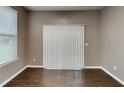 Well-lit dining area with dark wood floors and a sliding glass door at 4603 Parkway Circle, Atlanta, GA 30349