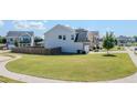 View of the home's backyard featuring a lush lawn and a privacy fence at 113 Cottage Walk, Cartersville, GA 30121