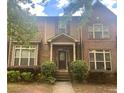 Traditional two-story brick home with charming curb appeal, showcasing a welcoming front entrance at 6158 Thorncrest Dr, Tucker, GA 30084