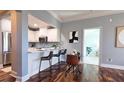 Well-lit kitchen with breakfast bar, stainless steel appliances, and stylish finishes at 2277 Peachtree Ne Rd # 507, Atlanta, GA 30309