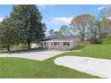 Quaint single-story house with large front yard and lengthy driveway at 3556 Riley Rd, Douglasville, GA 30134