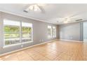 Spacious living room featuring tile flooring and an abundance of natural light at 3556 Riley Rd, Douglasville, GA 30134