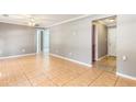 Open living area with tile floors and neutral paint, leading to bedrooms at 3556 Riley Rd, Douglasville, GA 30134