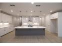 Open kitchen featuring white cabinets, stainless steel appliances, a gray island, and pendant lighting at 134 Wards Crossing Way # 17, Johns Creek, GA 30022