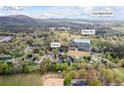 Aerial view of home highlighting its location relative to Cass High School and Hwy 411 at 65 Indian Springs Ne Dr, Rydal, GA 30171