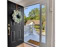 View from the front door to the outside shows a sunny day with a view of the front yard at 3027 Clove Tree Ln, Woodstock, GA 30189
