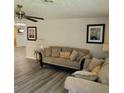 Comfortable living room with couches, neutral tones, ceiling fan and modern flooring at 3785 Somerset Sw Dr, Marietta, GA 30064