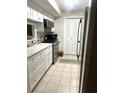 Well-lit kitchen featuring white cabinets, modern appliances, and ample counter space at 506 Park Ridge Cir, Marietta, GA 30068