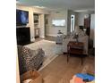 Bright living room with fireplace, TV, soft rug and comfortable seating at 506 Park Ridge Cir, Marietta, GA 30068