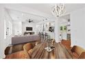 Open-concept living space with hardwood floors, seamlessly connecting living, dining, and kitchen areas at 733 Pegg Sw Rd, Atlanta, GA 30315